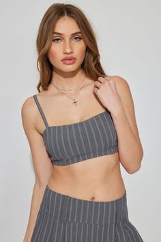 Say hello to your new going-out-top. Features - Adjustable shoulder straps - Zip closure at back - Lined Size & Fit - Fit: Fitted - Length: Ultra cropped Materials & Care - Content: 75% rayon, 22% nylon, 3% spandex - Machine wash, cold - Imported Summer Bandeau Top With Seamless Construction, Chic Bandeau Top With Straps, Seamless Summer Bandeau Top, High Stretch Nylon Crop Top With Built-in Bra, Gray Stretch Cotton Crop Top, Garage Tank Tops, Solid Micro-elastic Nylon Tops, Gray Stretch Tank Top, Bra Friendly, Check And Balance