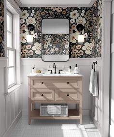 a bathroom with floral wallpaper and two sinks