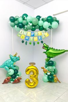 an image of a birthday decoration with balloons in the shape of animals and numbers 3