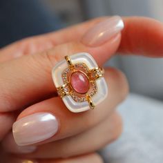 "Mid-Century Style Tourmaline Ring, Natural Pink Tourmaline Engagement Ring, Vintage Wedding Bridal Ring for Women, Pink Gemstone Ring, Gifts Material: 925 Sterling Silver with Gold Plated Gemstone: Natural Pink Tourmaline, Mother of Pearl & CZ Ring Size: Adjustable for US 4 to US 9 Don't forget to find more designs from our shop: https://www.etsy.com/hk-en/shop/NikiFashionJewelry Be sure to hit \"favorite\" on the right so it remains in your favorites list and/ or add to your wish list(s). Hope Wedding Cabochon Sapphire Ring Fine Jewelry, Elegant Pink Enamel Ring, Elegant White Crystal Ring With Stone Setting, White Ruby Gemstone Ring For Formal Occasions, Formal White Ruby Gemstone Ring, Formal White Ruby Ring, Cabochon Sapphire Ring For Wedding, Cabochon Ruby Ring For Wedding, White Rings With Gemstone Accents