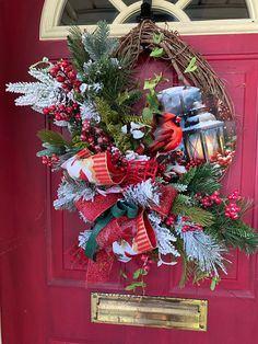 a christmas wreath hanging on the front door