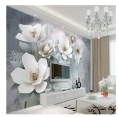 the living room is decorated in white and gray tones with flowers painted on the wall