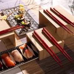 sushi and chopsticks are arranged on the table