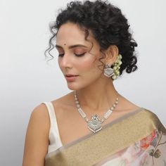 The Maati Elephant & Pearl Antique Oxidized Necklace Set is inspired by timeless Indian traditional motifs with modern aesthetics. The necklace features an elephant motif adorned with pearl string chains and pearl drops giving it a classic look while the antique silver oxidized plating imparts a unique rustic look to the entire setting. The accompanying earrings are also adorned with elephant motifs and pearl drops. The necklace set looks graceful when paired with traditional outfits such as sar Garba Outfit, South Indian Temple, Indian Jewelry Set, Earring Indian, Elephant Motif, Navratri Garba, Black Beads Mangalsutra, Indian Fashion Jewellery, Temple Jewelry