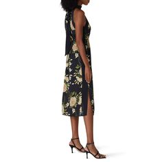 Black floral printed crepe (100% Polyester). Hourglass. Sleeveless. Halter neckline. Fully lined. 50" from shoulder to hemline. Imported. Elegant Sleeveless Floral Dress For Daywear, Sleeveless Printed Midi Dress For Date Night, Floral Print Halter Neck Midi Dress For Date Night, Chic Floral Print Sleeveless Dress For Daywear, Chic Sleeveless Printed Floral Dress, Spring Floral Print Sleeveless Dress For Date Night, Sleeveless Floral Dress For Date Night, Chic Floral Print Sleeveless Halter Neck Dress, Chic Halter Neck Sleeveless Dress With Floral Print