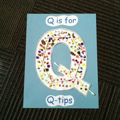 a q is for q - tips card with confetti on it