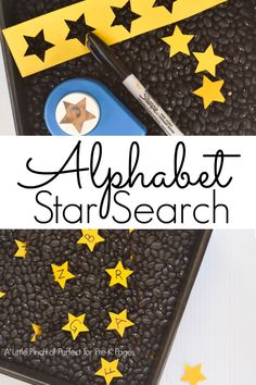 a black tray with yellow stars on it and the words alphabet star search next to it