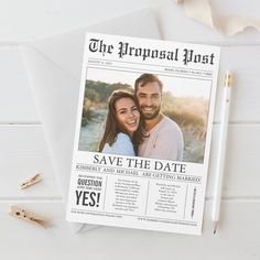 an image of a wedding save the date card on top of a white envelope with gold pen