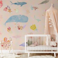 a baby's room decorated in pink and blue