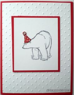 a polar bear with a party hat on it's head