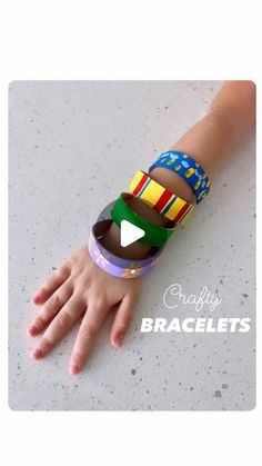 a child's hand wearing a colorful bracelet