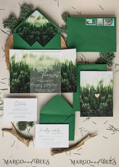 wedding stationery with green envelopes and trees