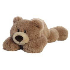 a brown teddy bear laying on its side