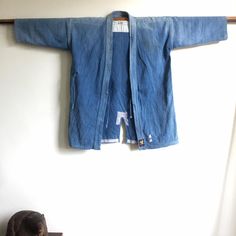 Vintage from the 1970s vintage Japanese indigo dyed kendo jacket From Japan Size shoulder to shoulder : 23" (58.4 cm) Chest 23" (58.4 cm) length: 32" (81.5 cm) The fabric is discolored and authentic from wear and tear. But I think it's a beautiful work of art. Vintage Indigo Outerwear Pre-washed, Indigo Washed Cotton Denim Jacket, Washed Indigo Cotton Denim Jacket, Washed Indigo Denim Jacket In Cotton, Vintage Indigo Pre-washed Outerwear, Vintage Pre-washed Indigo Outerwear, Pre-washed Indigo Cotton Outerwear, Indigo Cotton Outerwear With Natural Dye, Blue Cotton Outerwear With Natural Dye