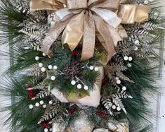 a christmas wreath hanging on the front door