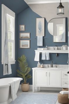 a bathroom with blue walls and white fixtures