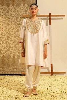 Ivory chauga kurta with gota patti, dabka, zardozi embroidery on the placket, cuffs. Paired with a salwar with embroidered hem. - Aza Fashions Cream Raw Silk Kurta With Traditional Drape, Beige Raw Silk Kurta With Naqshi, Off White Raw Silk Kurta With Naqshi, White Naqshi Salwar Kameez For Reception, Traditional Drape Cream Kurta With Naqshi, Beige Kurta With Dabka Work In Traditional Drape, Cream Kurta With Naqshi In Traditional Drape, Cream Naqshi Kurta With Traditional Drape, Designer Raw Silk Kurta In Beige