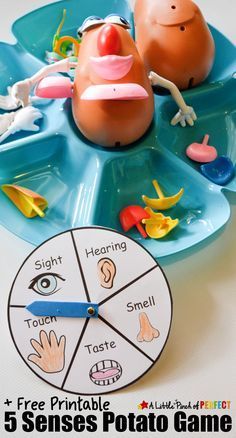 a close up of a clock on a table with toys