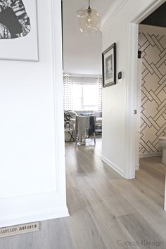 the hallway is clean and ready to be used as a dining room or living room