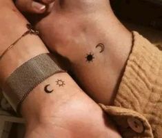 two people with matching tattoos on their arms