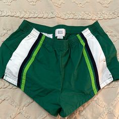 No Flaws Never Worn Sporty Green Athletic Shorts For Beach Season, Green Sports Bottoms For Beach Season, Sporty Green Athletic Shorts For Spring, Sporty Short Swim Trunks For Spring, Stretch Green Shorts For Beach Season, Green Athletic Shorts For Spring And Summer, Spring Green Swim Trunks With Elastic Waistband, Green Stretch Athletic Shorts For Vacation, Green Short Swim Trunks For Spring