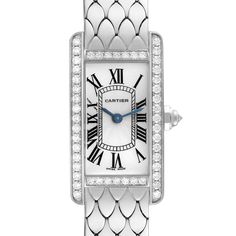 Cartier Tank Americaine White Gold Diamond Ladies Watch WB710009. Quartz movement. 18K white gold case 19.0 x 35.0 mm. Octagonal crown set with an original Cartier factory faceted diamond. 18k white gold original Cartier factory diamond bezel. Scratch resistant sapphire crystal. Silvered grained dial with black Roman numerals. Sword shaped blued steel hands. 18K white gold bracelet with hidden butterfly clasp. Fits 6.5" wrist. Jlc Watch, Cartier Tank Americaine, Cartier Calibre, Cartier Tank, White Gold Bracelet, Gold Case, Bezel Diamond, Ladies Watch, Roman Numerals