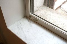 a window sill that has a handle on it