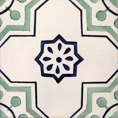 an artistic tile design with blue and green accents