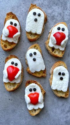 some bread with white frosting and red noses