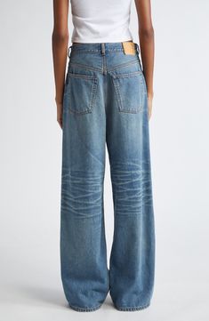 Unexpected pleats accentuate the baggy silhouette of faded jeans cut from heavily whiskered, nonstretch denim in a wide-leg silhouette. 32 1/2" inseam; 22" leg opening; 13 1/2" front rise; 15" back rise (size 23) Zip fly with button closure Five-pocket style 100% cotton Machine wash, tumble dry Made in Italy Designer Clothing Classic Faded Wide Leg Bottoms, Faded Jeans, Wide Leg Jeans, Leg Jeans, Designer Clothing, Wide Leg, In Italy, Nordstrom, Candy