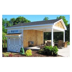 a white shed with a wooden roof