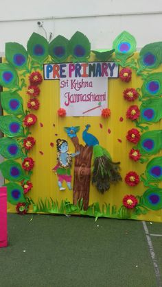 the door is decorated with peacocks and flowers for an upcoming school day celebration at pre primary