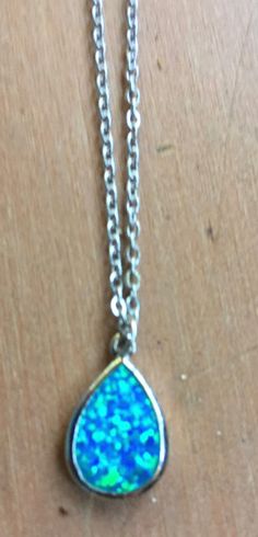 "Magical, glittery powder blue teardrop stone pendant, says China FD 925 on the back so it's manufactured by \"FD\" and it's made of 925 silver. It's hard to capture the texture of the pendant in my photos, but it's a sparkly blue with green iridescent highlights, and very smooth to the touch. The chain measures about 20\" and the pendant is about .625 by .5\". Please take a look at my storefront at: https://www.etsy.com/shop/FabFinds42?ref=seller-platform-mcnav I have a wide selection of one-of Blue Teardrop Pendant Necklace In Sterling Silver, Blue Sterling Silver Teardrop Pendant Necklace, Blue Teardrop Spiritual Jewelry, Adjustable Blue Teardrop Drop Necklace, Adjustable Teardrop Blue Drop Necklace, Handmade Blue Teardrop Pendant Drop Necklace, Blue Sterling Silver Drop Necklace For Gift, Blue Sterling Silver Drop Necklace As A Gift, Handmade Blue Teardrop Drop Necklace