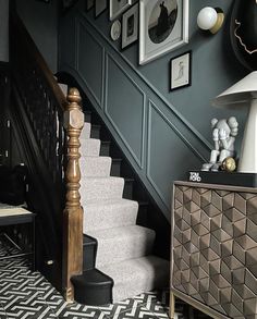 the stairs in this house are decorated with black and white decor