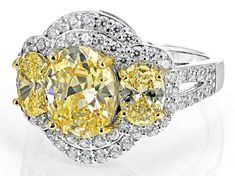 Bella Luce® canary and white diamond simulants 8.47ctw round and oval rhodium over sterling silver and Eterno™ 18k yellow gold over sterling silver yellow prongs ring. Measures approximately 0.88"L x 0.69"w and is not sizable. The diamond equivalent weight is 5.13ctw. Yellow Round Jewelry With Pave Setting, Yellow Jewelry With Diamond Accents, Gia Certified Fine Yellow Jewelry, Gia Certified Yellow Fine Jewelry, Fine Jewelry Oval Yellow Jewelry, Fine Jewelry Yellow Oval Jewelry, Fine Yellow Oval Jewelry, Yellow Pave Setting Jewelry For Wedding, Yellow Jewelry With Pave Setting In Round Cut