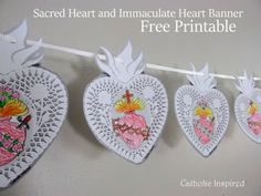 three paper hearts hanging on a line with the words sacred heart and immaculate heart banner free printable