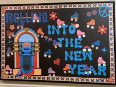 a sign that says, rolling into the new year on a black background with colorful decorations