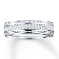 a white gold wedding ring with two lines on it