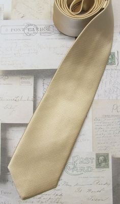 This trendy skinny tie is made of a 100% silk, all new material.It measures 58" long and 2.25" at the widest point. Gold Silk Tie For Formal Occasions, Gold Dapper Ties For Weddings, Fitted Gold Tie For Semi-formal Occasions, Elegant Gold Neckwear With Ties, Luxury Gold Ties For Business, Gold Stripes, Ties Mens, Neck Tie, Stripes