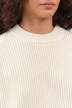 The Konan Sweater is a beautiful crewneck pullover with ribbed details throughout. It has a standard easy fit, gently tapering at the hem. With a slightly dropped shoulder and double ribbed neckline, this sweater exudes a chic and stylish look.