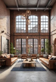 an industrial living room with large windows and couches