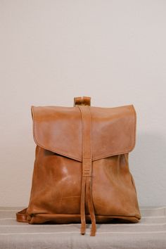 Effortless meets utility in the Makanisa Backpack. You'll never have to sacrifice your outfit for the convenience of a backpack again. 100% leather. Soft Leather Backpack For On-the-go, On-the-go Soft Leather Standard Backpack, On-the-go Soft Leather Satchel Backpack, School Backpack With Leather Lining, Leather Backpack With Leather Lining For Daily Use, Everyday Leather-lined Satchel Backpack, Leather-lined Backpack For Everyday Use, Everyday Leather Backpack With Adjustable Strap, Everyday Satchel With Leather Lining And Backpack Shape