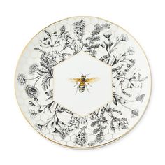 a white and black plate with a bee on it