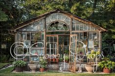 an old greenhouse with potted plants in it and the word garden written on the side