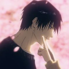 an anime character with black hair is holding his hand to his face