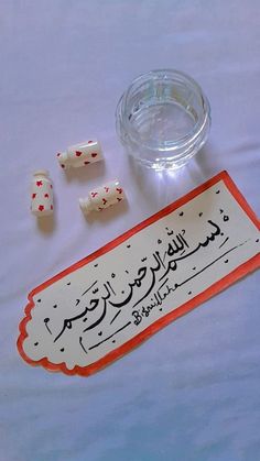 some dice are sitting on a table next to a sign