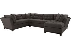 a large sectional couch sitting on top of a white floor