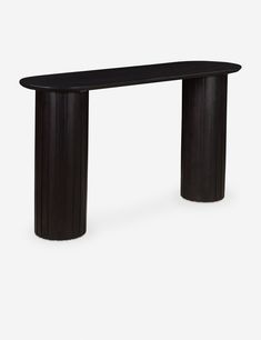 a black console table with an oval shaped top and columns on the sides, against a white background