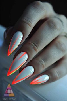 Turn up the heat with these white nails with rhinestones, where neon outlines blaze against a soft white canvas, bringing a fierce energy to the classic stiletto shape. If you're ready to stand out, ignite your look with more white nails acrylic styles at NailHow.com. White Style Nails, Summertime Nails 2024, Simple Stiletto Nails Designs, White And Neon Nails, Cute Almond Nails, Almond Nails Pink, White Nail Designs