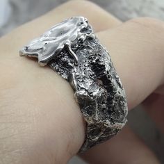 Project50g | Maker's mark ring- unusual ring for men with a unique texture of molten silver and stone – project50g Silver Sterling Jewelry With Unique Texture, Sterling Silver Jewelry With Unique Texture, Brutalist Hand Cast Open Ring, Silver Brutalist Hammered Ring, Brutalist Hammered Silver Ring, Silver Jewelry With Unique Texture, Unique Silver Jewelry With Unique Texture, Silver Brutalist Hand-cast Rings, Brutalist Silver Hand Cast Rings